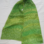 Newgrange Green 1 - oblong silk scarf painted in various shades of green spirals like those in Newgrange.
